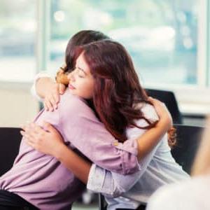 divorce litigation woman hugging counselor image